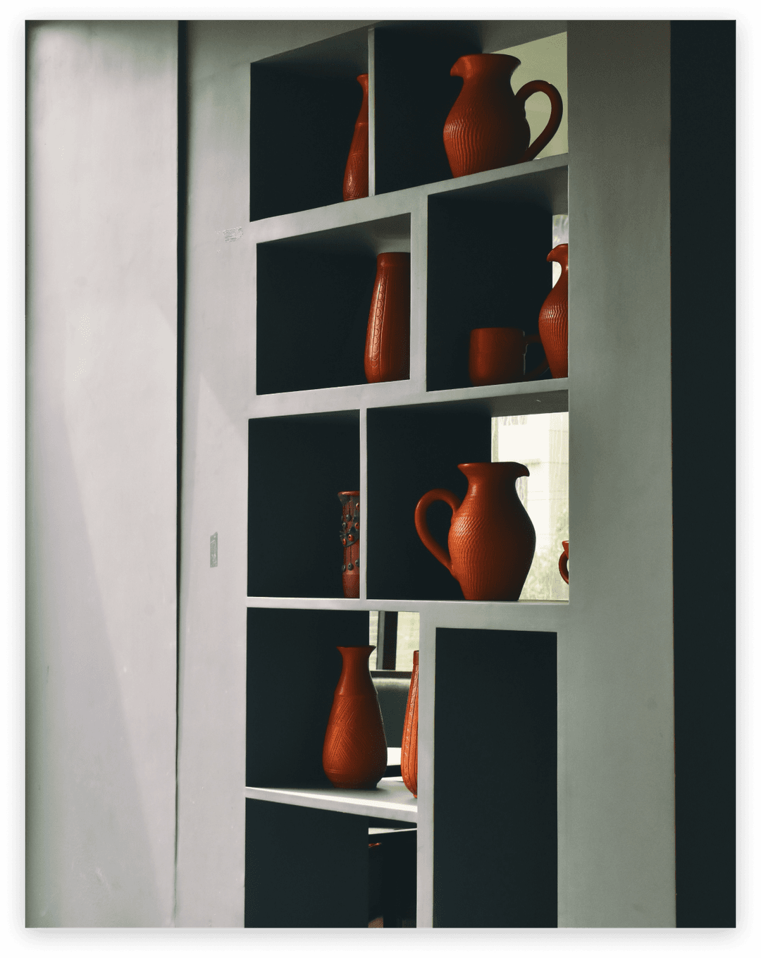 Shelves with terracotta vases